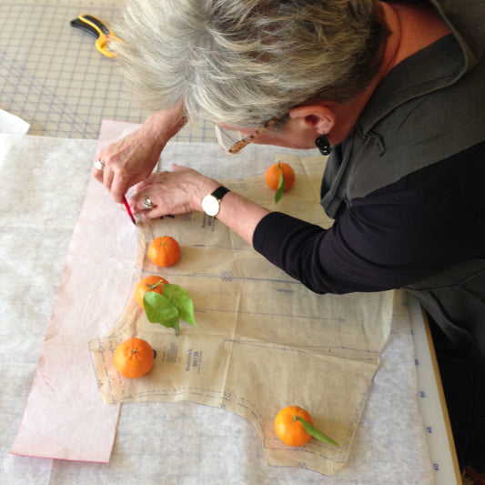 Gayle Ortiz using tangerines as pattern weights at DOL