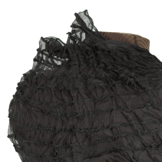 Q: what's BLACK scrunchy, translucent, and makes you feel magical?
