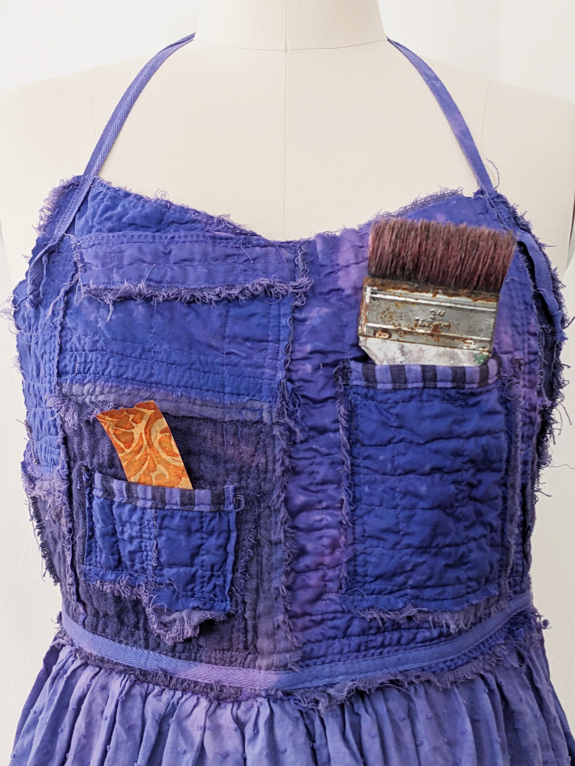 Secret Lentil purple apron, stuff in pockets