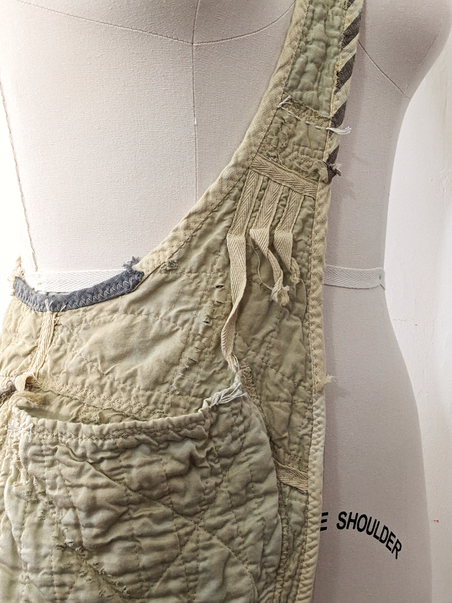 secret lentil artifacted sling apron, frayed detail