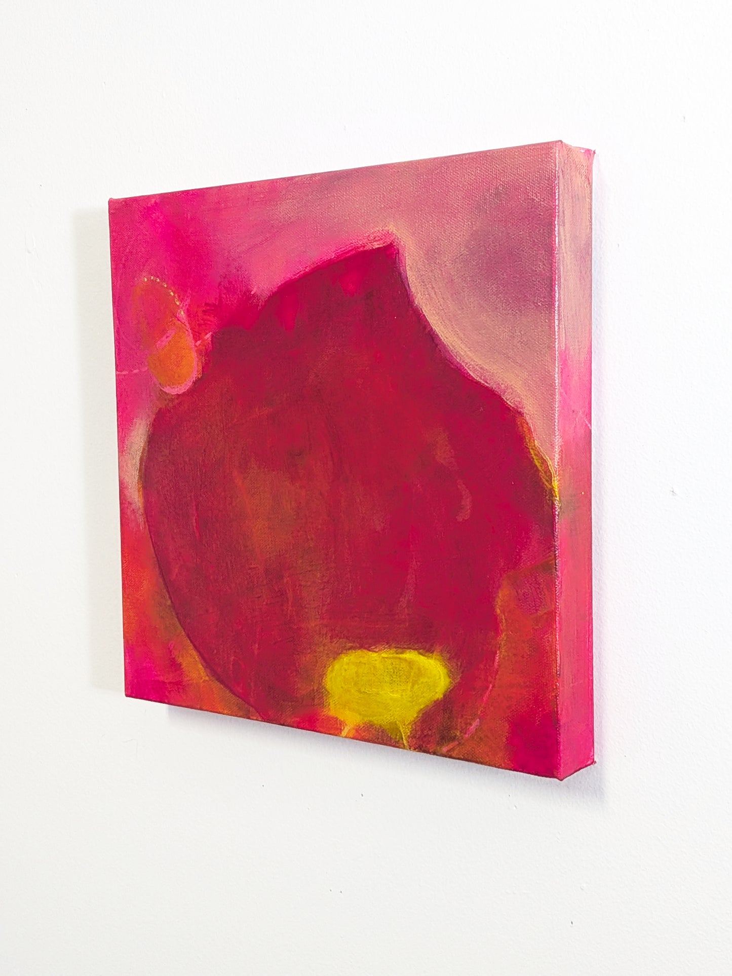 tabla beet science by helen carter. Abstract painting featuring a large central dark red and brown organic shape with bright pink, orange, and yellow areas around it.