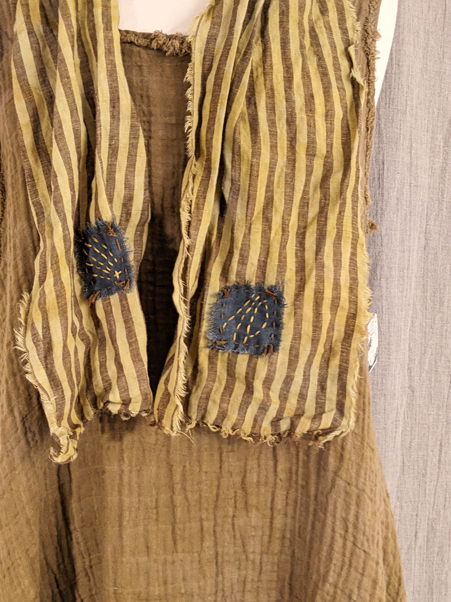 mustard brown and muted blue hand-dyed striped linen scarf with hand-stitched patches