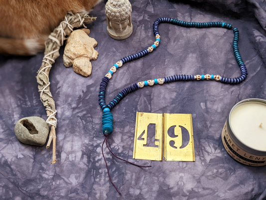 soothsayer beads necklace in purple, aqua and teal with SKULLS