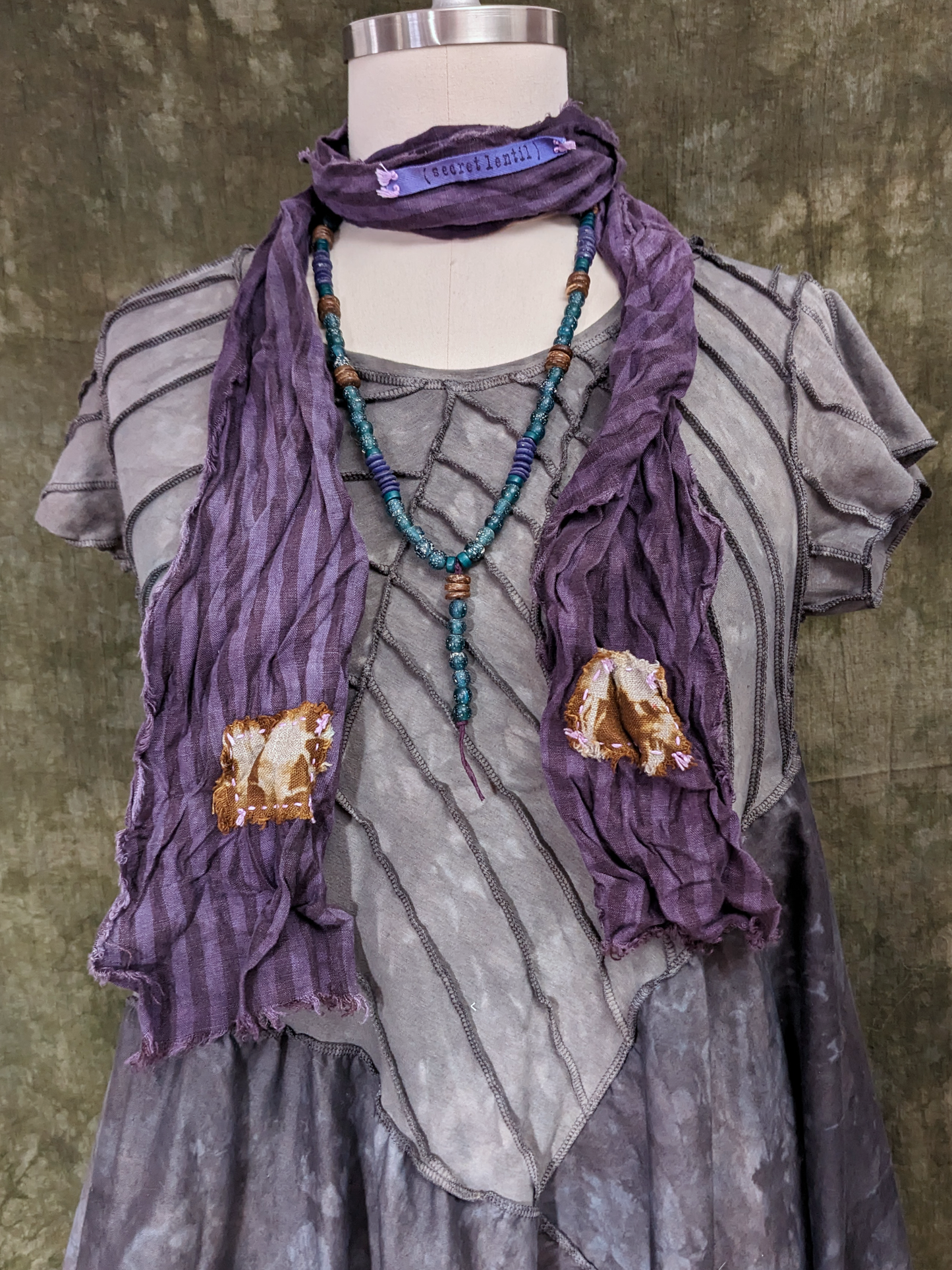 purple and golden brown hand-dyed striped linen scarf with hand-stitched patches